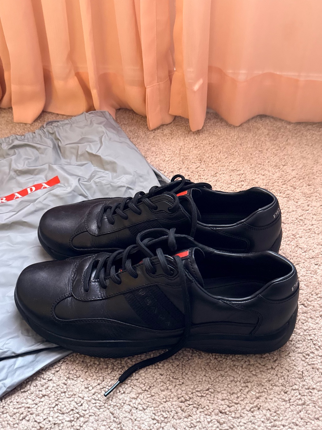 Prada Black Leather Low-Top Sneakers With Red Tongue Tab